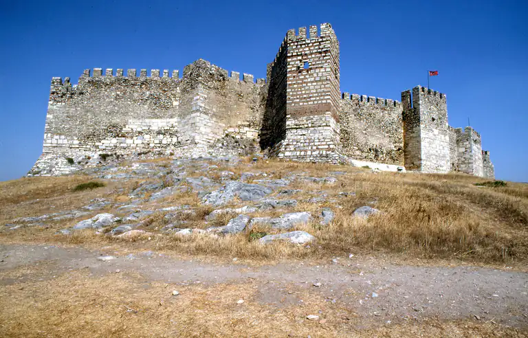 The crenellated walls and square keep of Ayasuluk castle on the hilltop