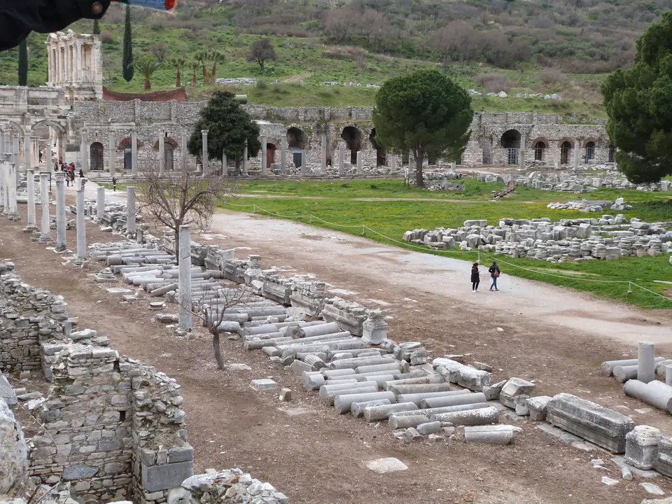 The Commercial Agora's toppled columns, with the Library of Celsus in the background