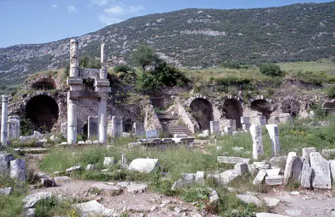 The vaulted substructure of the Temple of Domitian terrace with re-erected figure pillars in front