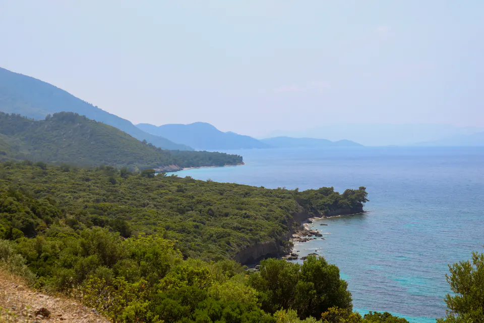 Wooded slopes meeting the Aegean Sea on the Dilek Peninsula