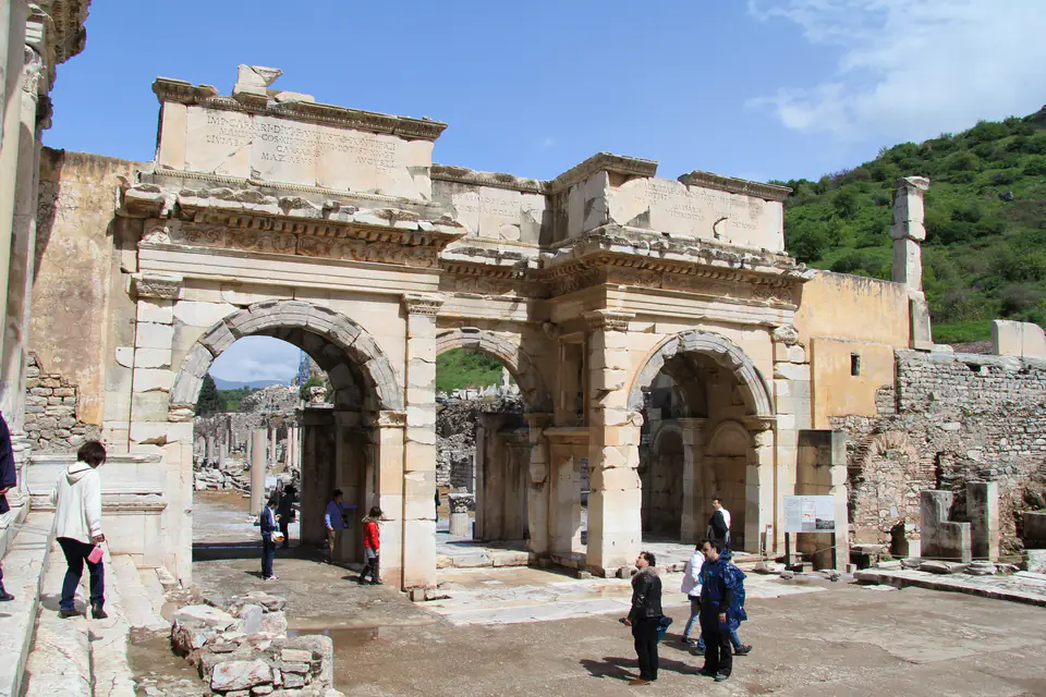 The triple-arched Gate of Mazaeus and Mithridates, with visitors passing through