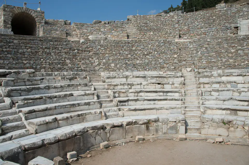 The semicircular marble seating of the Odeon at Ephesus with its arched upper entrance