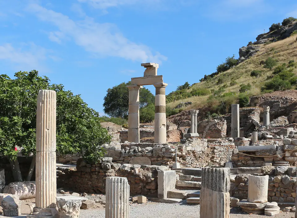 The two re-erected Doric columns of the Prytaneion under a blue sky